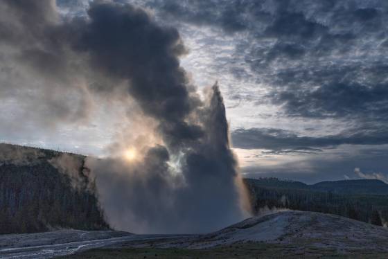 Old Faithful at Dawn Old Faithful eeupting in Yellowstone National Park